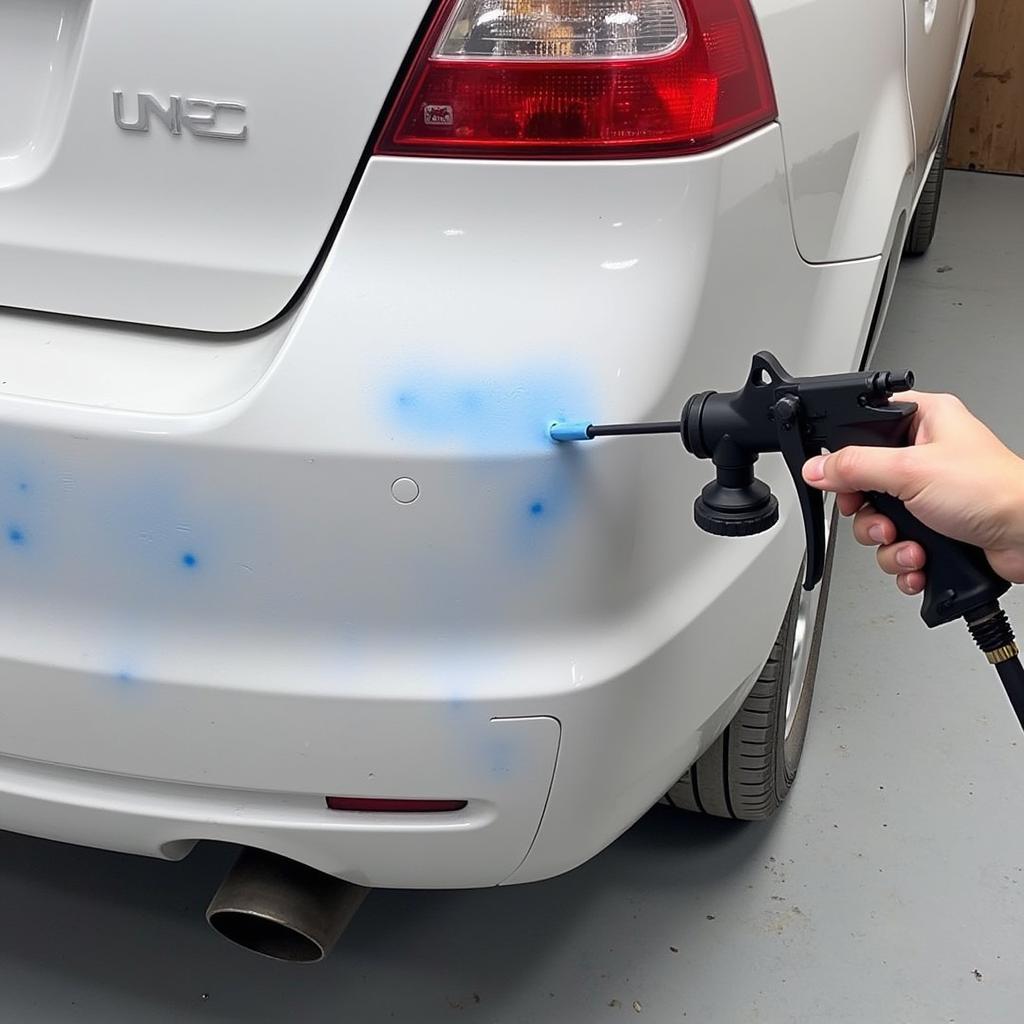 Painting a repaired car bumper