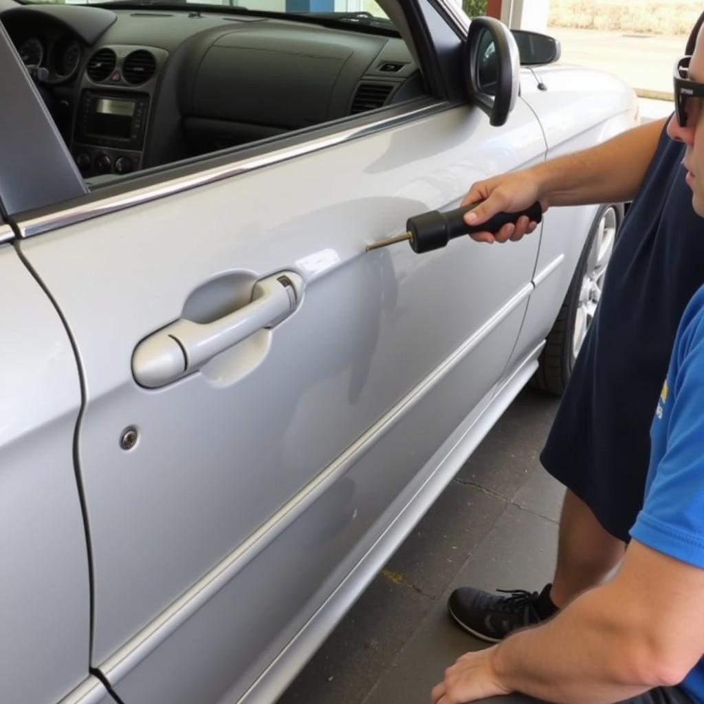 Paintless Dent Repair Process on a Car Door