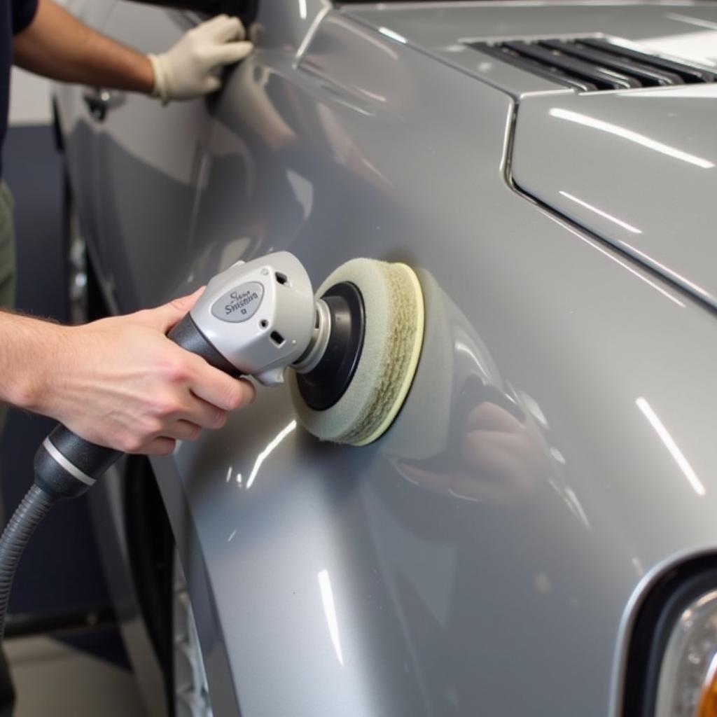 Polishing freshly painted car to restore shine