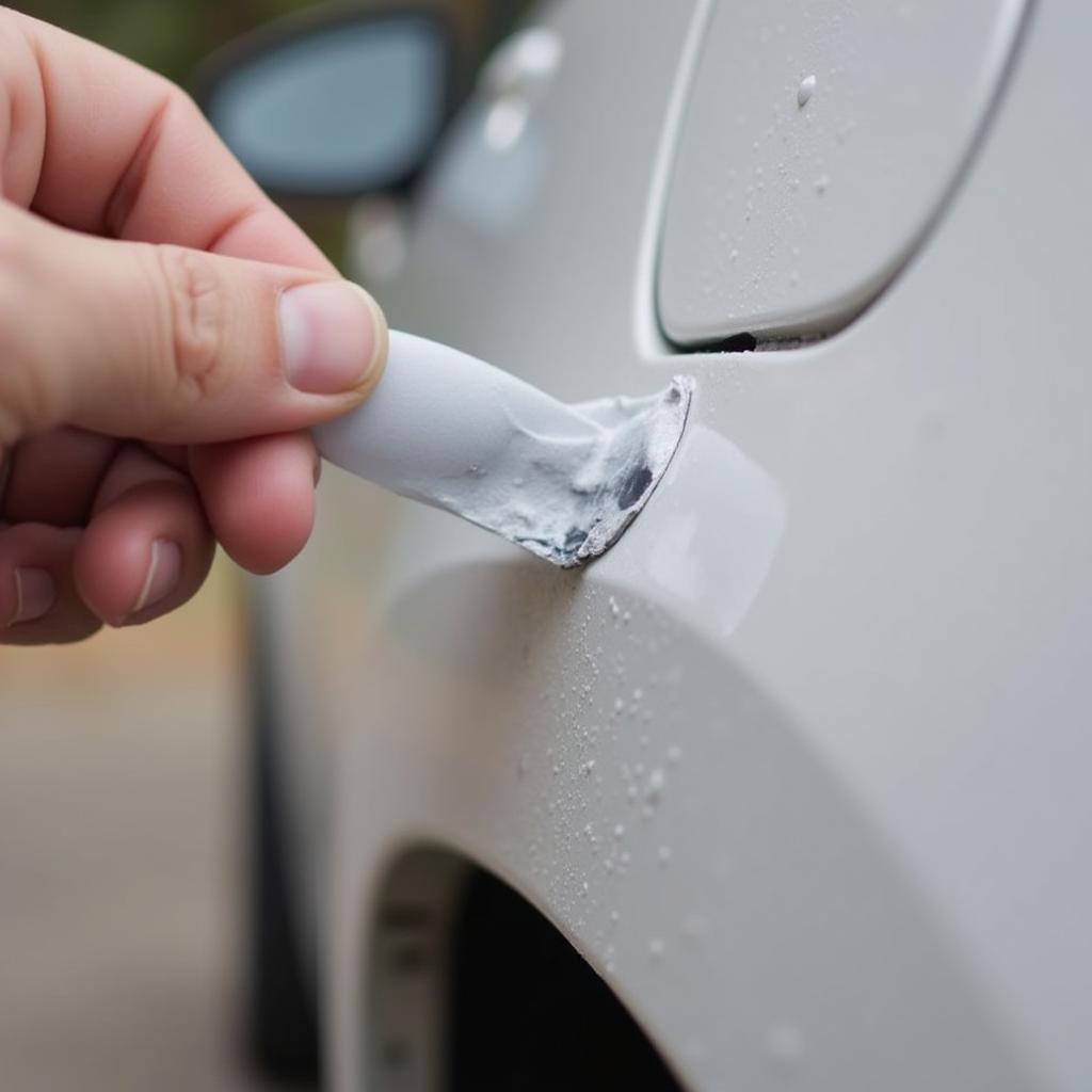 Removing Thick Spray Paint with a Plastic Razor Blade