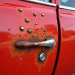 Rust Bubbles Forming on Car Door Panel