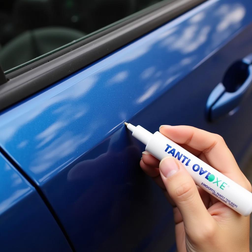 Applying Tetrosyl Touch Up Pen to Car Scratch