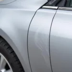 Toyota Car with Scratched Door Panel Requiring Paint Repair