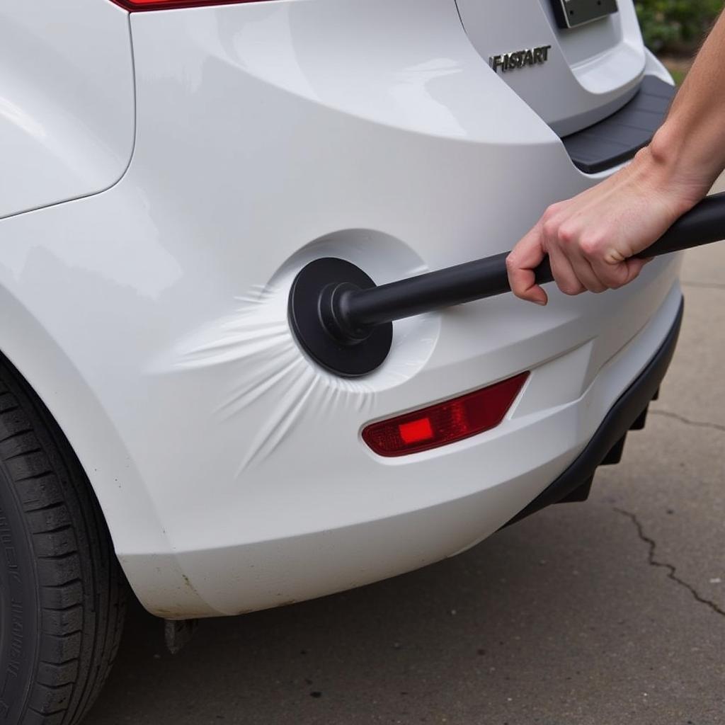 Using a Plunger to Repair a Car Bumper Dent