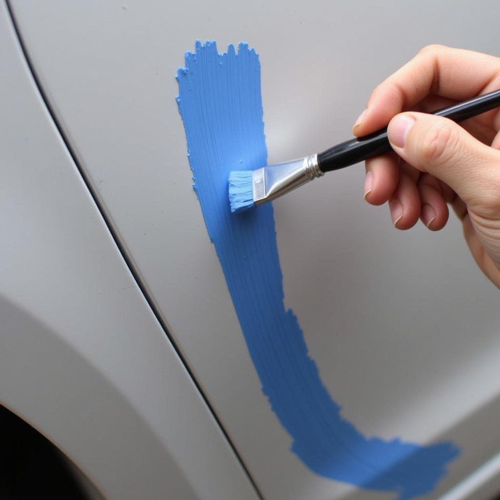 Using a Touch-Up Paint Kit on a Car Scratch