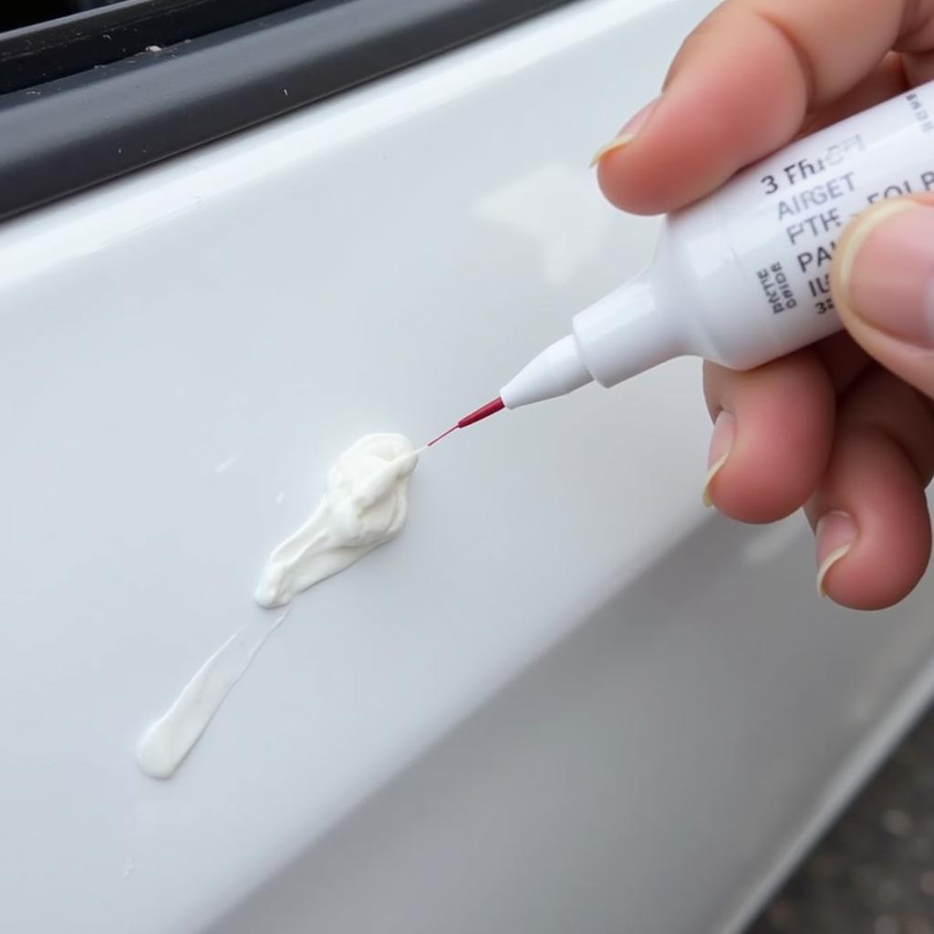 Applying White Pearl Touch Up Paint to a Car Scratch